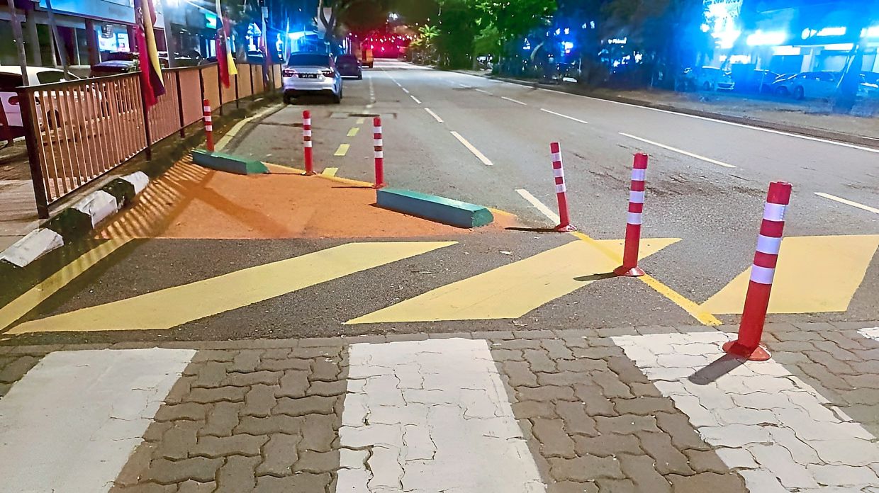 A proposed plan to convert the left lane of Jalan Tun Mohd Fuad into public parking could also affect the nearby bus stop. — Photo courtesy of Abu Hafiz