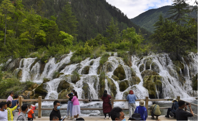 Stranded tourists evacuated from China's famed Jiuzhaigou World Heritage site after mudslides, heavy rain