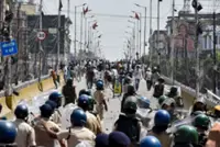 India suspends policeman for firing AK-47 at student protesters
