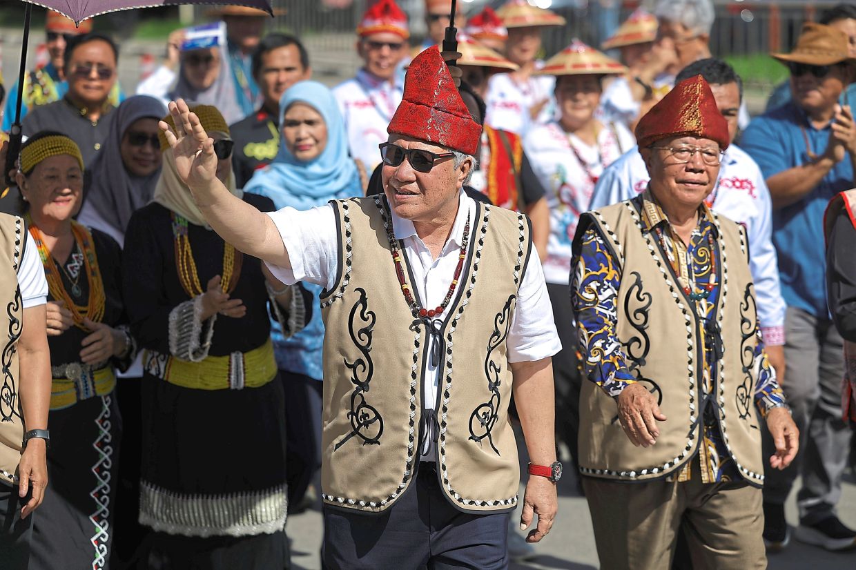 Awang Tengah waving to the festival crowd.
