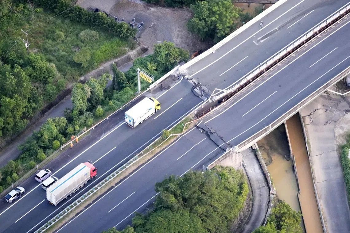 An aerial view shows the damaged Kyushu Expressway after an earthquake with a magnitude of 7.1 struck Japan's southern Kumamoto prefecture, in Yatsushiro, Japan, on July 28. -- PHOTO: REUTERS