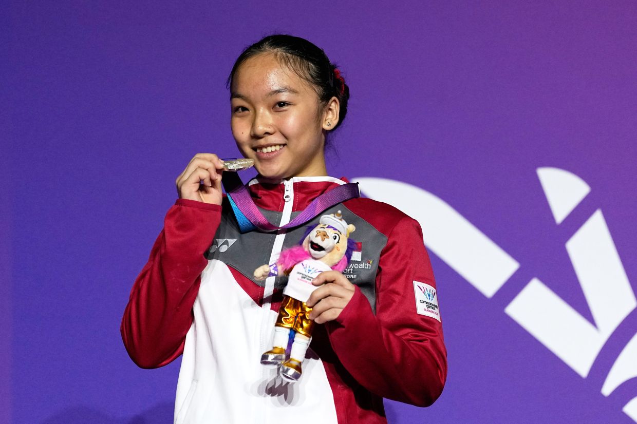 Amanda Yap of Singapore poses for a photograph with her silver medal after finishing second in the Women's Balance Beam final of Artistic Gymnastics at the Commonwealth Games in Glasgow, Scotland, on Tuesday, July 28, 2026. -- AP Photo/Manish Swarup