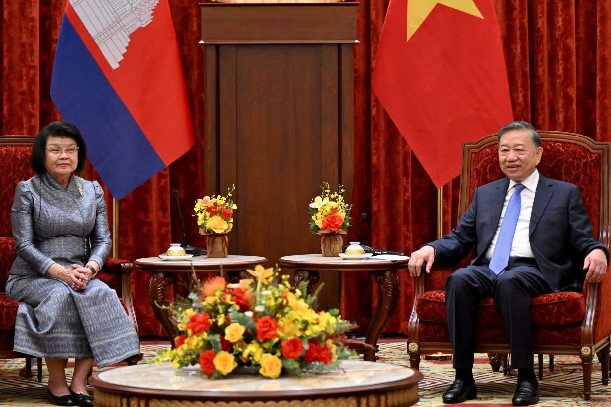 Vietnam's President To Lam (R) attends a meeting with Cambodia's National Assembly Chairman Samdech Khuon Sudary in Hanoi on Tuesday, July 28, 2026. -- Photo by Nhac NGUYEN / AFP