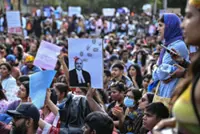 India activists demand release of detained 'cockroach' protesters