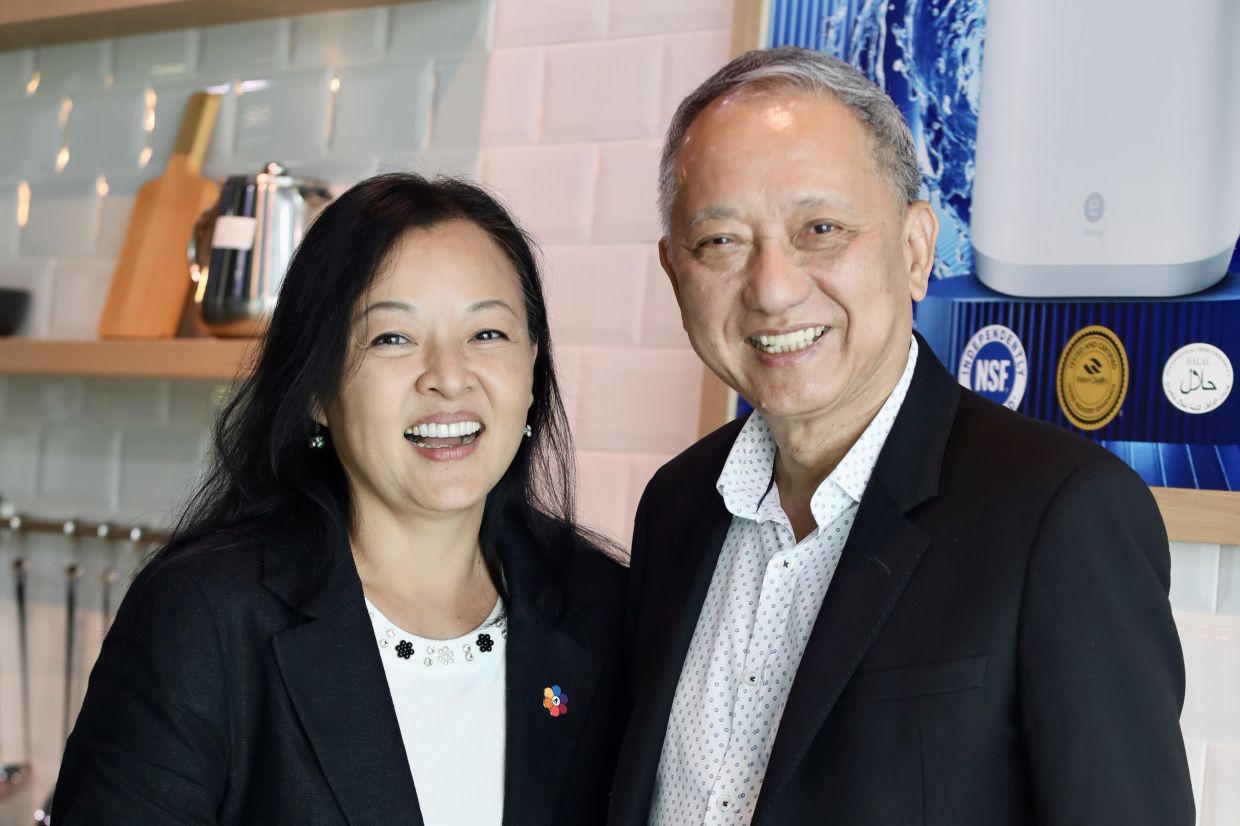 Grit and grace: Amway Founder Crown Ambassadors Khoo and his wife, Tracy Teh, posing in joy after attending the AM50 celebration at the Amway headquarters in Petaling Jaya. 