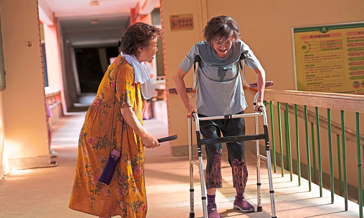 Michelle Yeoh (right) says she made it a point to observe the walking style of an elderly woman to make her character as authentic as possible. Photo: Handout
