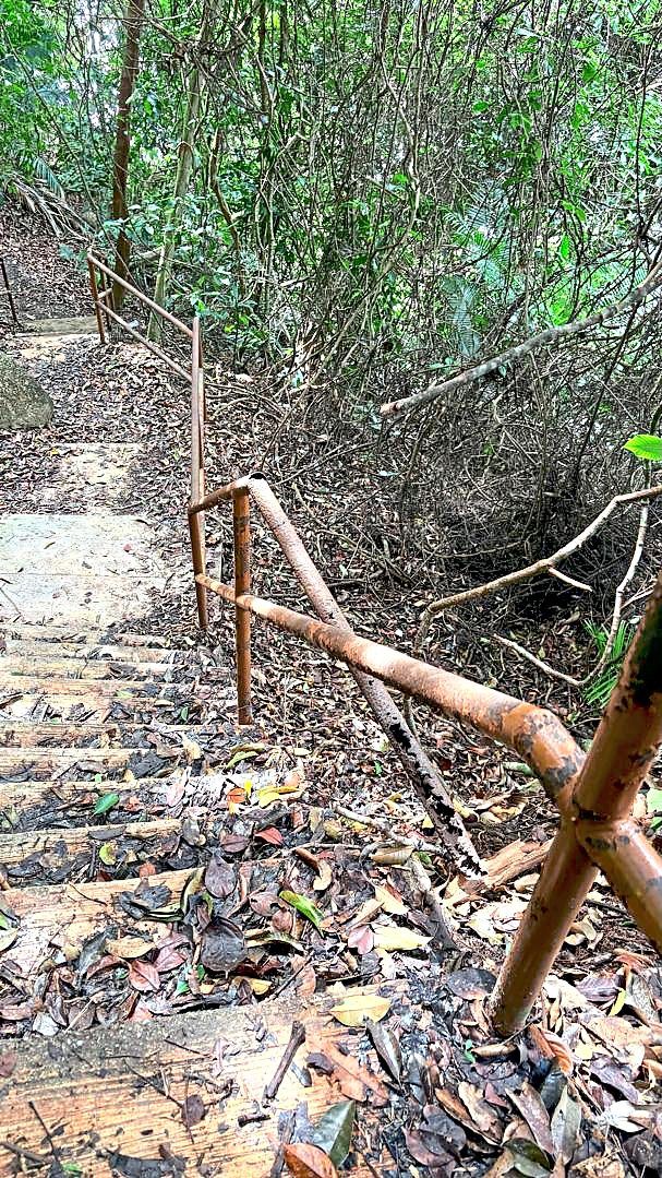The rusted steel railings pose a danger to hikers and children.