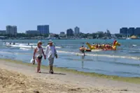 Even at the beach, it's hard for Russians to escape the war