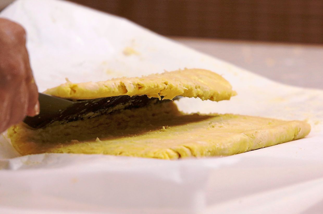 Fold the dough in thirds like a letter, roll again into the same size, repeating up to four times.