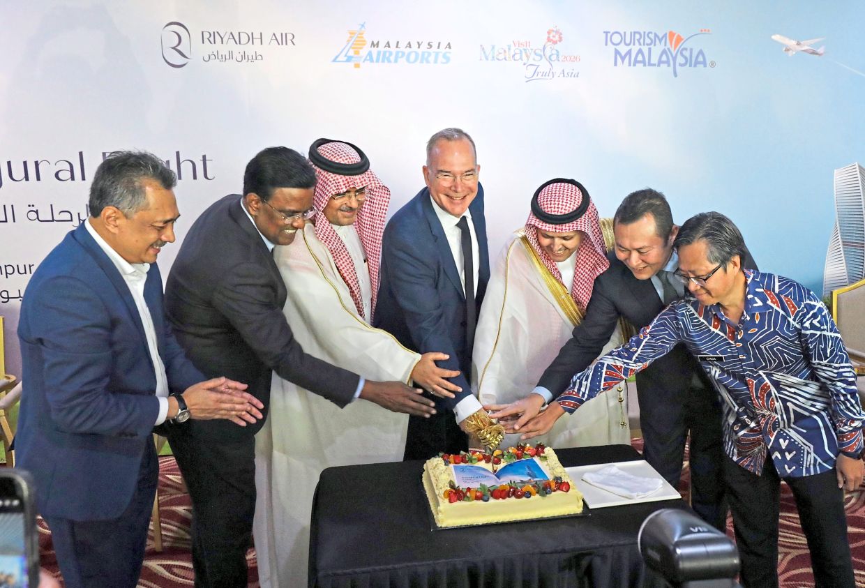 It’s official: (From left) Mohd Izani, Jana Santhiran, Mubsher, Coste, Osamah, Syed Mohamad Bakri and Chua cutting a cake at the welcome reception of Riyadh Air at KLIA’s Terminal 1. — SAMUEL ONG/The Star
