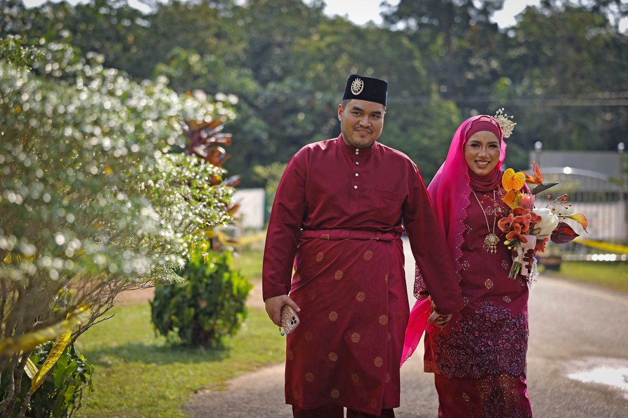 Marketing officer Noor Farzana Masnoor, 26, was accompanied by her husband, Luqman Adam Sudirman, 27, as she voted at the Sekolah Jenis Kebangsaan Tamil (SJKT) Ladang Kubang polling centre in Labu for the Labu constituency.