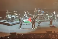 Massive Attack banned from Singapore over Palestinian flag display