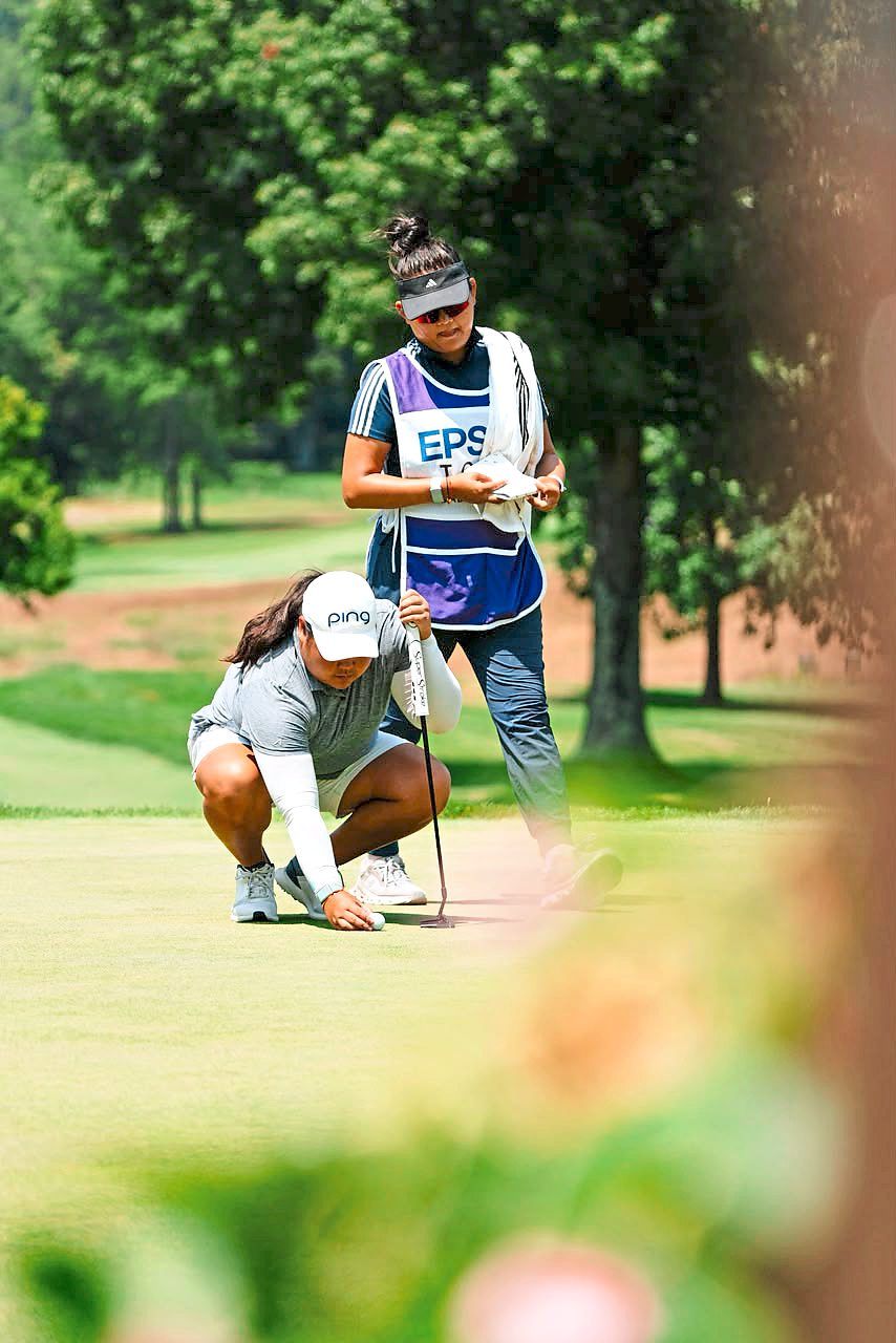 Mirabel, who crafted a career-best second-place finish on the Epson Tour, lines up a putt while Michelle looks. — Photo: Handout
