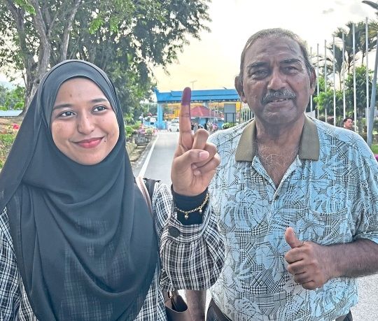 Nur Farah and her father.