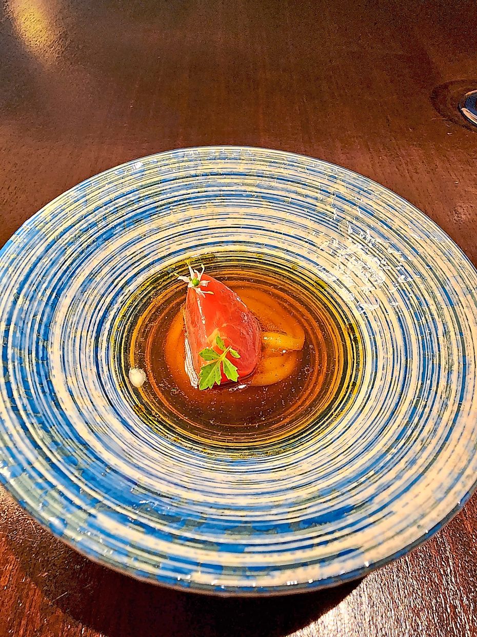 Low's hand-cut cassava noodles are soaked in a tomato-infused broth in a combination that offers bounce, spring and astringency. — ABIRAMI DURAI/The Star