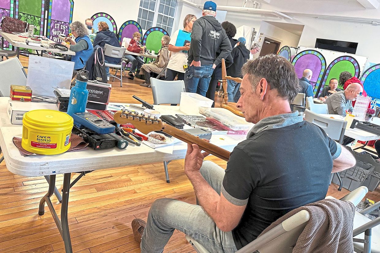Music repair coach James Dean Conklin helps people fix theirinstruments.