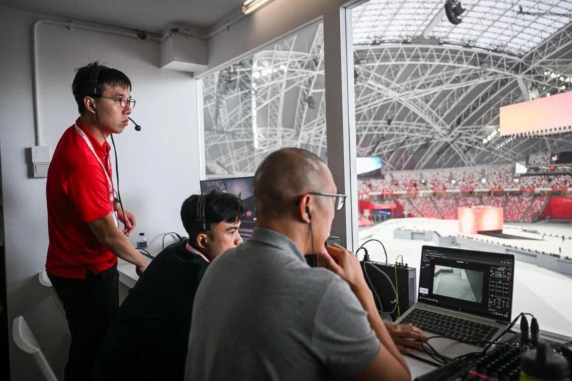 LTC Koh Jun Kiat, chairman of show management (in red), in action at the National Stadium on July 31. - Photo: ST