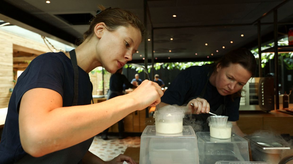 Staff at Noma work in the kitchen ahead of the opening of the restaurant in Copenhagen, Denmark.