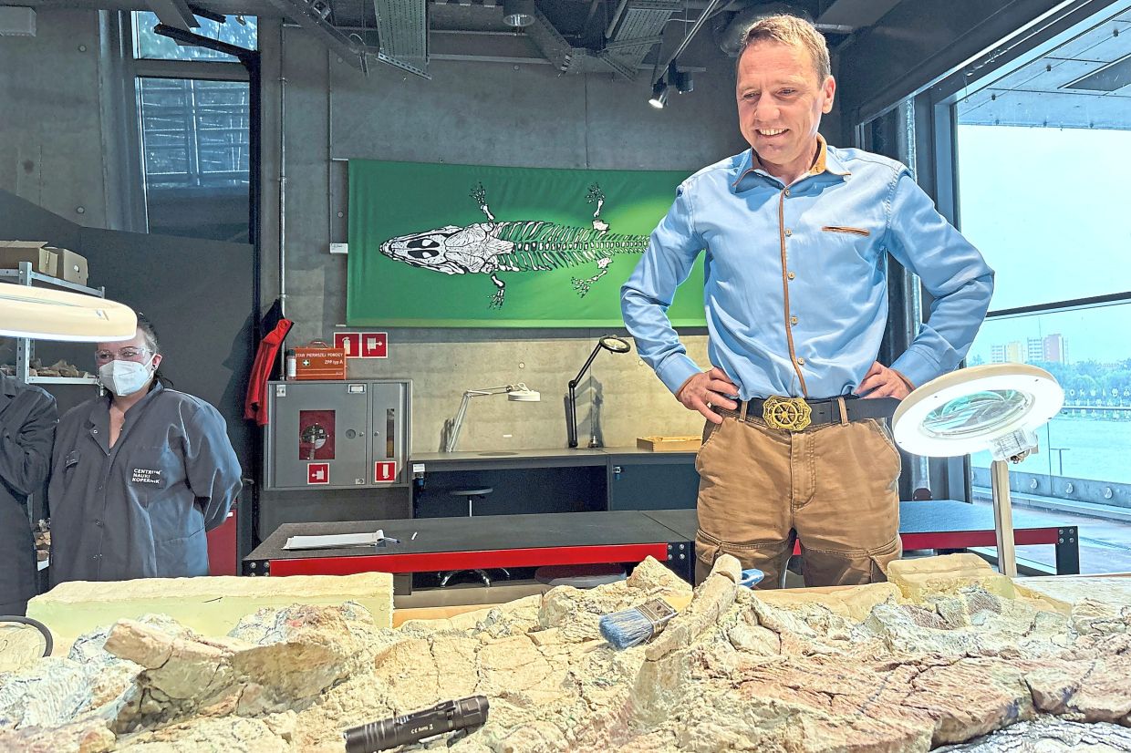Sulej (pictured) and his colleague Pawlak are credited with discovering the skeleton in southern Poland in 2023 and coming up with the idea to invite volunteers to help with its restoration.
