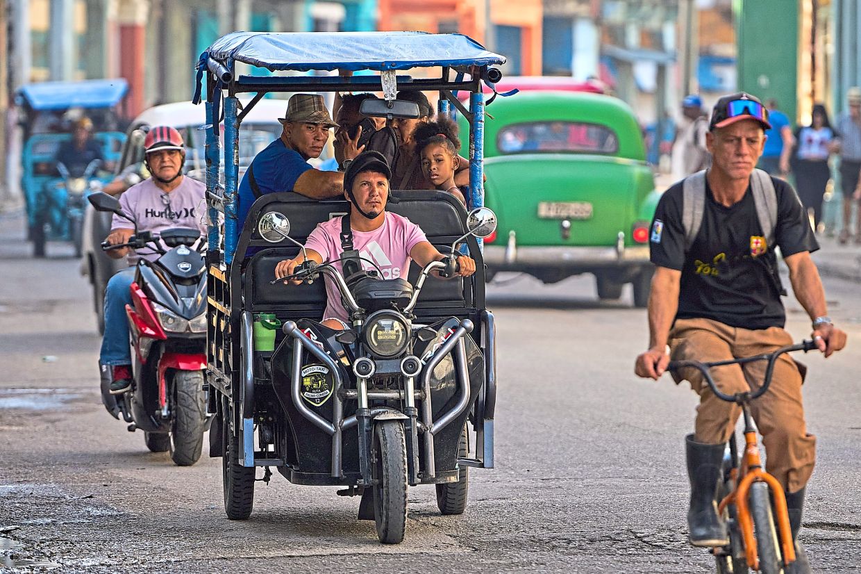 Cubans are turning to solar-powered tricycles amidst a prolonged fuel crisis