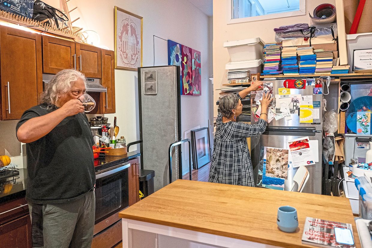 Johnson (right) and Carrillo each maintain their own homes. Here they are pictured in Johnson's Old City apartment.