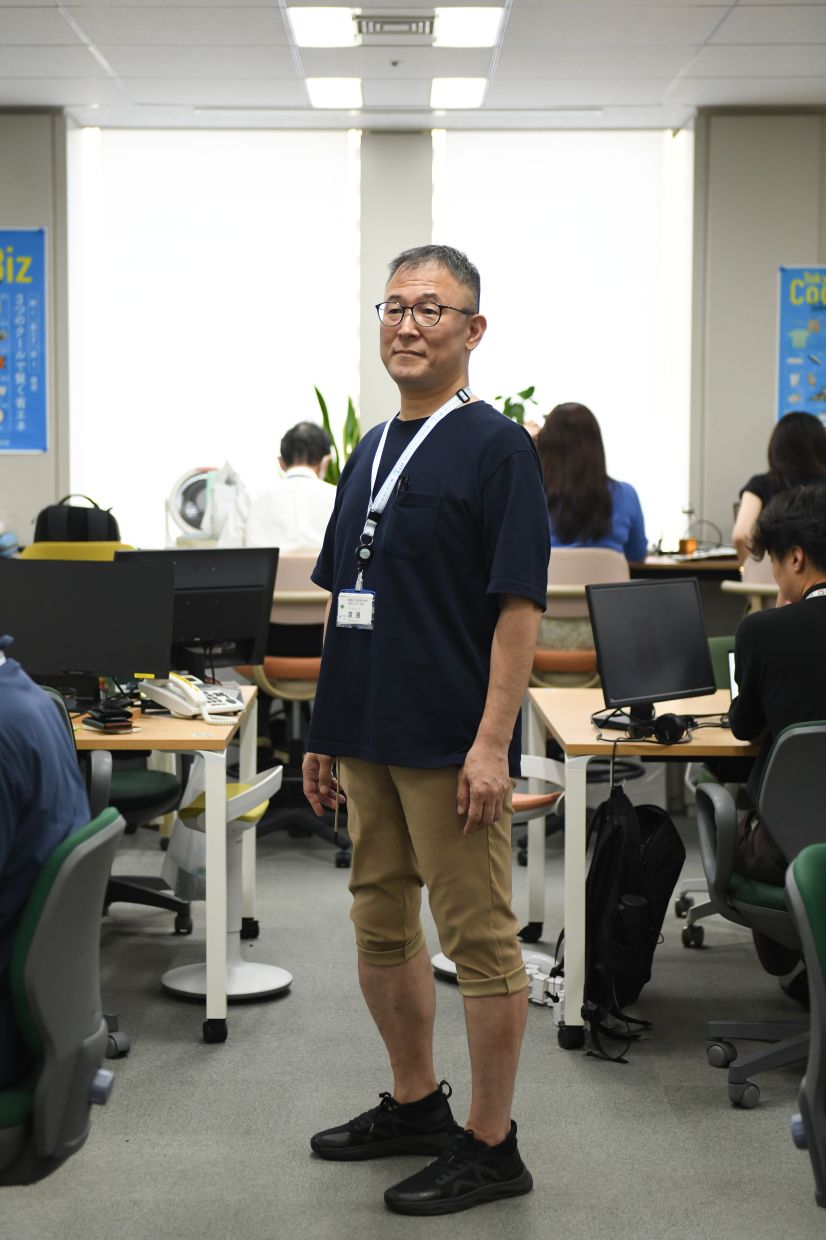 Noboru Watanabe, an environmental official in Tokyo, Japan, who ditched the uniform for a T-shirt and a pair of khaki shorts .