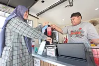 Teen with learning disability thrives with ‘pay as you like’ juice stall