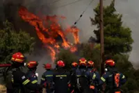 Two die as firefighting helicopters collide in Greece, French blaze changes course