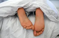 Will you sleep better naked when it's hot? Sleep researchers weigh in