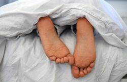 Will you sleep better naked when it's hot? Sleep researchers weigh in