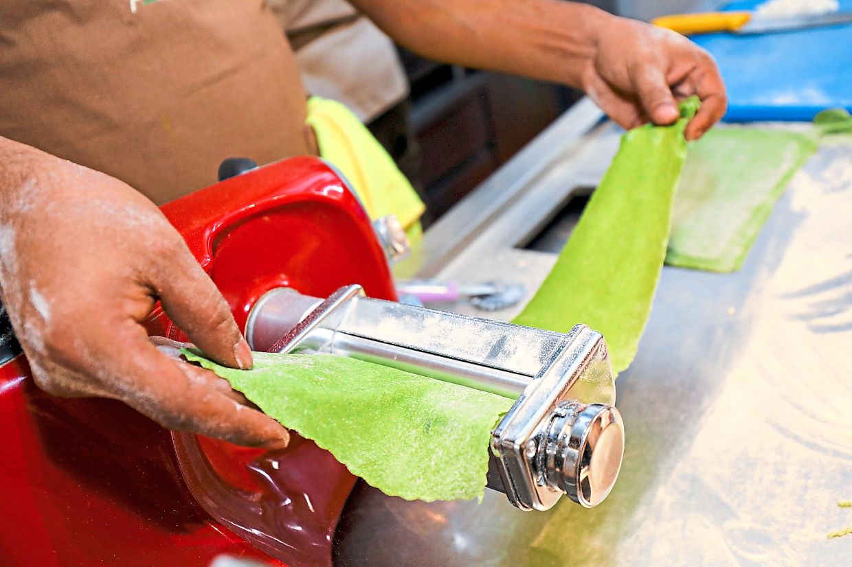 Pasta machines help stretch the dough out into thin sheets.