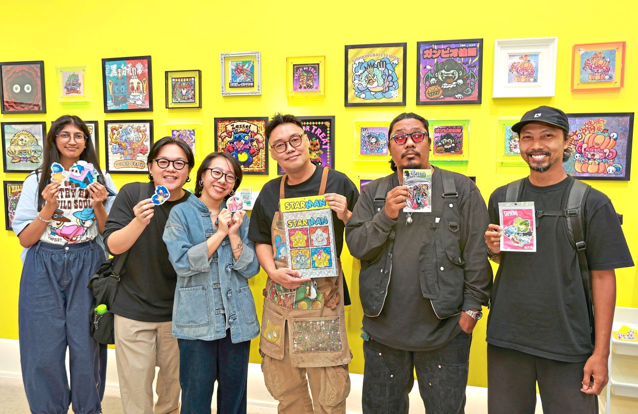 Participating artists in Sticky Friends include (from left) Siti Amirah (Morwyth), Darrel Cheong (Kamabokoo), Julia Wee (Zpinktuna), Allan Chan (Seanlon.art), Nor Ridzuan (Cawand) and Mohd Shamsuzzaman (Maman Rosnan). Photo: The Star/Chan Tak Kong