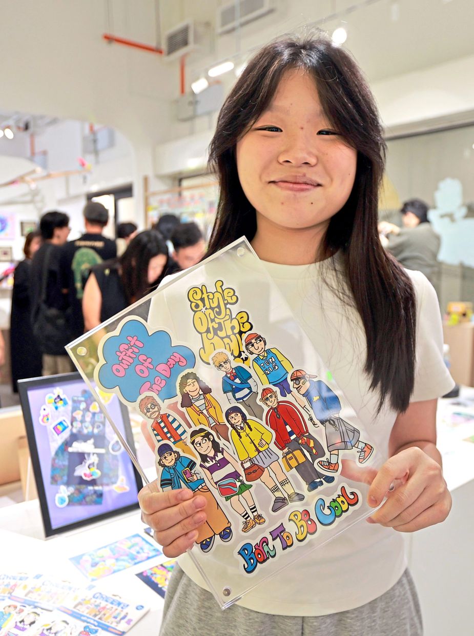The youngest artist at 'Sticky Friends' is Enya Lim, 14, who has also participated in the KL Art Book Fair and KL Illustration Fair. Photo: The Star/Chan Tak Kong