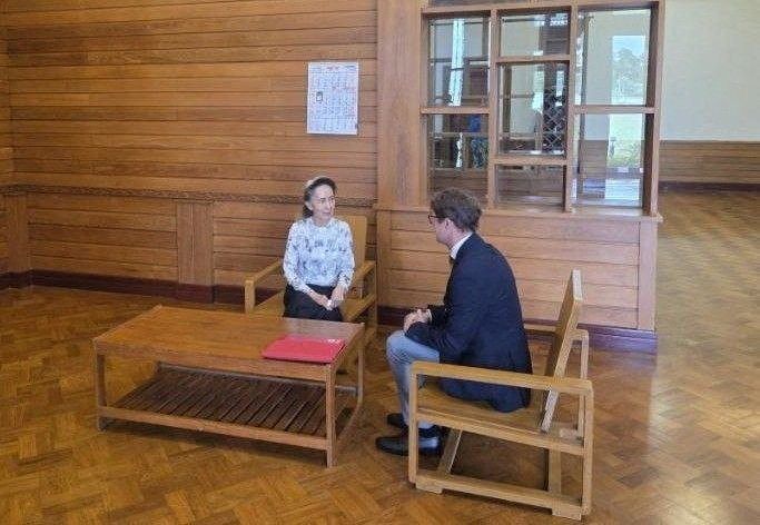 Myanmar's detained former leader Aung San Suu Kyi meets Myanmar's Resident Representative and Head of Delegation for the International Committee of the Red Cross (ICRC), Arnaud de Baecque, in Naypyidaw, Myanmar, August 3, 2026. -- Khine Khine Soe, Myanmar Government spokesperson/Handout via REUTERS