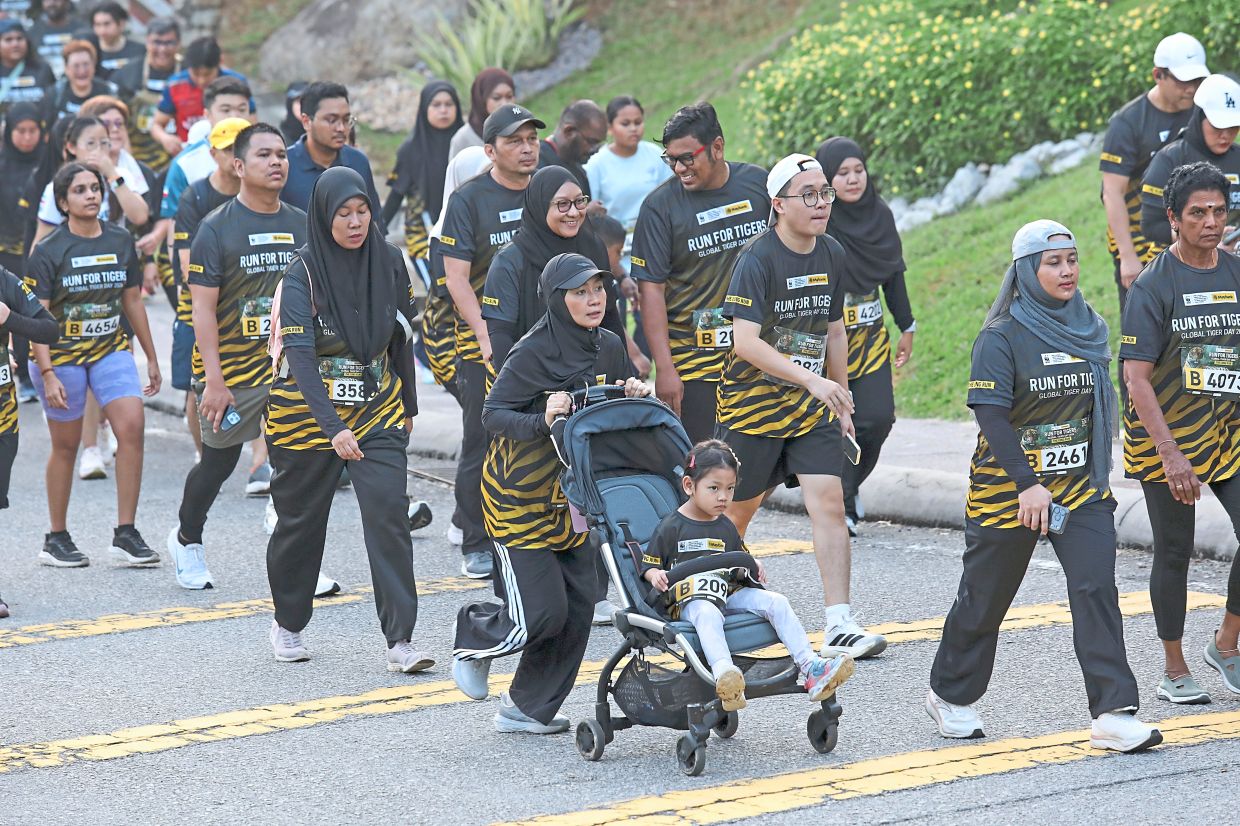 Thousands, including families, took the time to run while highlighting the message about the critically endangered Malayan tiger.