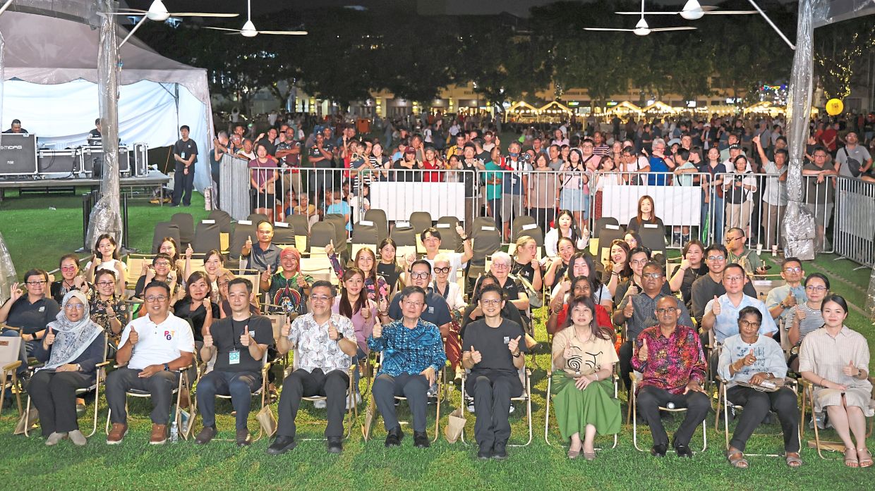 Chow (fifth from left) flanked by Wong (to his right) and George Town World Heritage Incorporated general manager Dr Ang Ming Chee, alongside other state leaders and event organisers during the launch of George Town Festival 2026 at Padang Kota Lama.