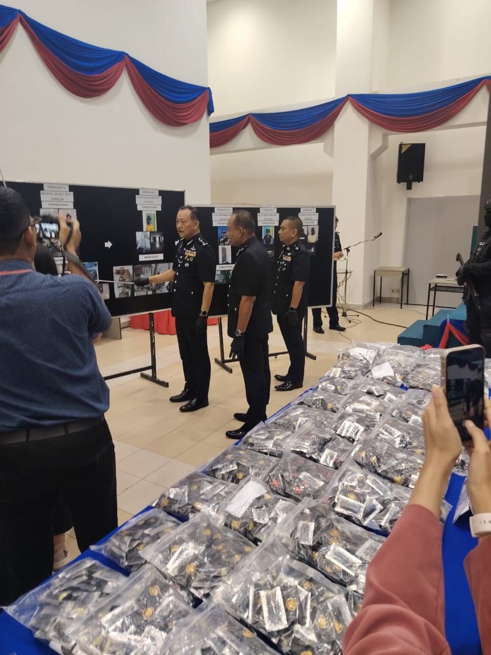 Johor Deputy Police Chief Deputy Comm Hoo Chuan Huat explaining about the raids against a drug syndicate during a press conference in Johor Baru.