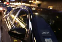 Uber forecasts weak quarterly profit, doubles down on robotaxi investment plans