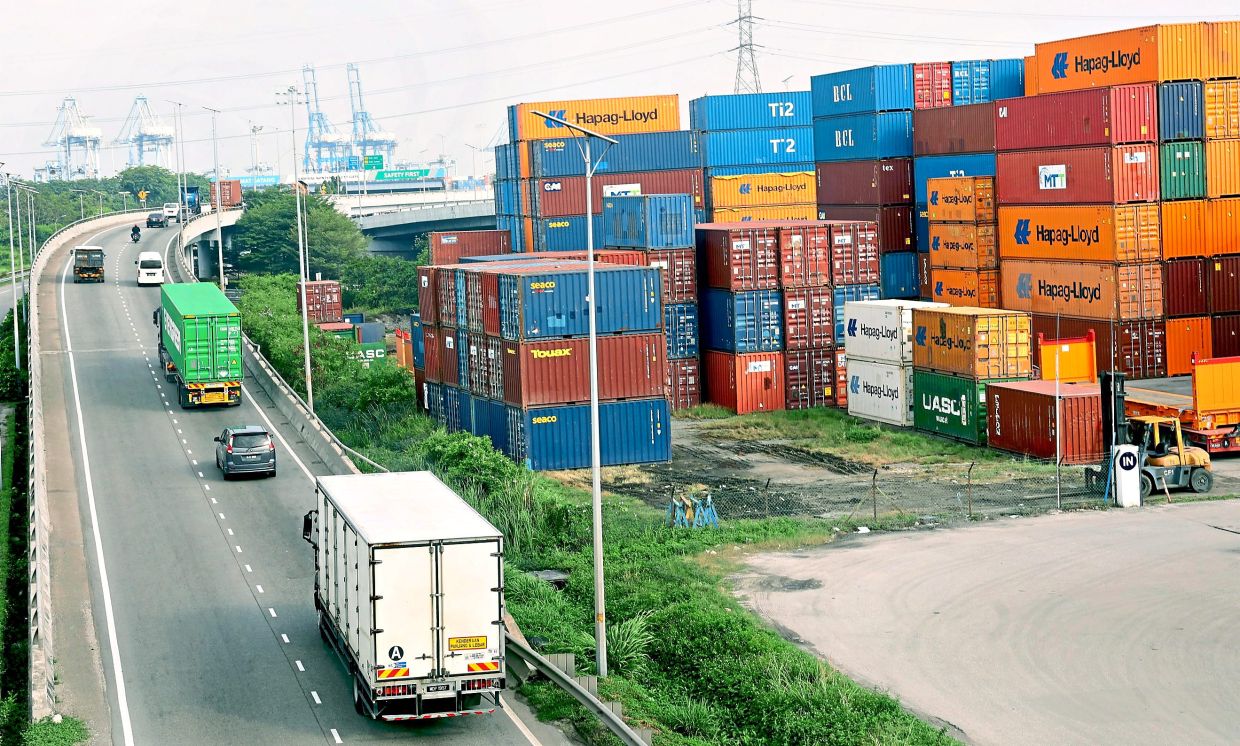 High demand: Hundreds of containers stacked up at a logistics warehouse in Northport, Port Klang, as Malaysians flock to e-commerce platforms. — KK SHAM/The Star