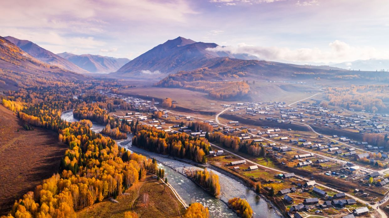 In Northern Xinjiang’s Hemu Village, a mountainside plateau offers visitors a bird’s eye view over the quaint village.