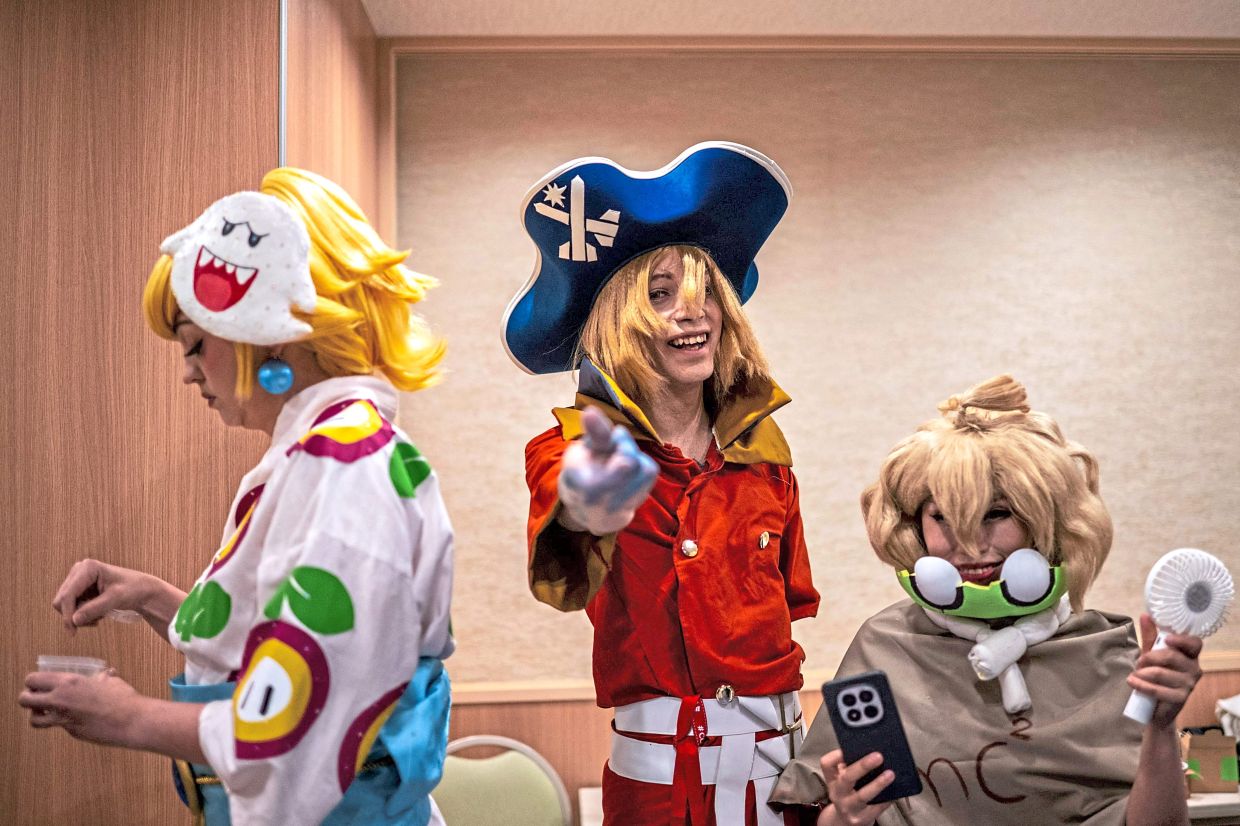 Cosplayers gathering in a hotel before taking part in the Osu Cosplay Parade in Nagoya.