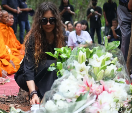 Sharina Nazimova placing a cup of coffee, Diana’s favourite drink, at the memorial as a personal tribute and a reminder of the memories they had shared together. - The Nation/ANN