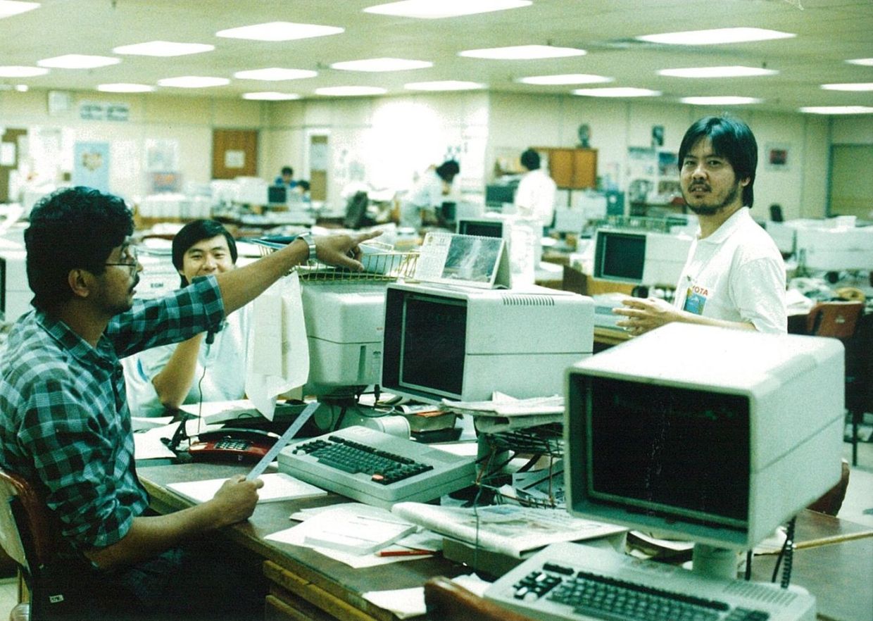 Dorairaj (left) with former production editor Khoo Teng Jin (centre) and former senior regional manager of operations David Yeoh in The Star newsroom in 1990.