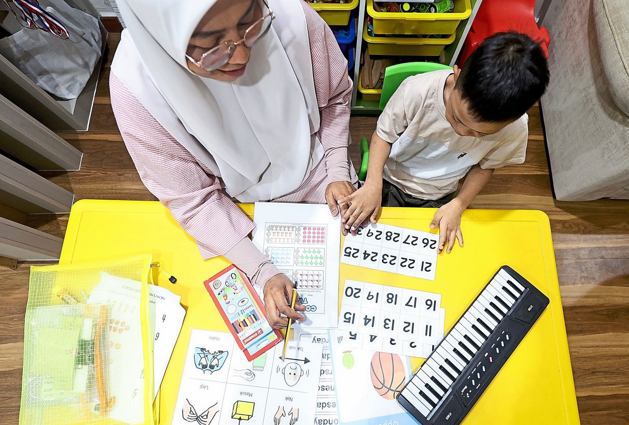 Fazelah spends over RM1,000 monthly on Muhammad Afiq’s therapy and development programmes.