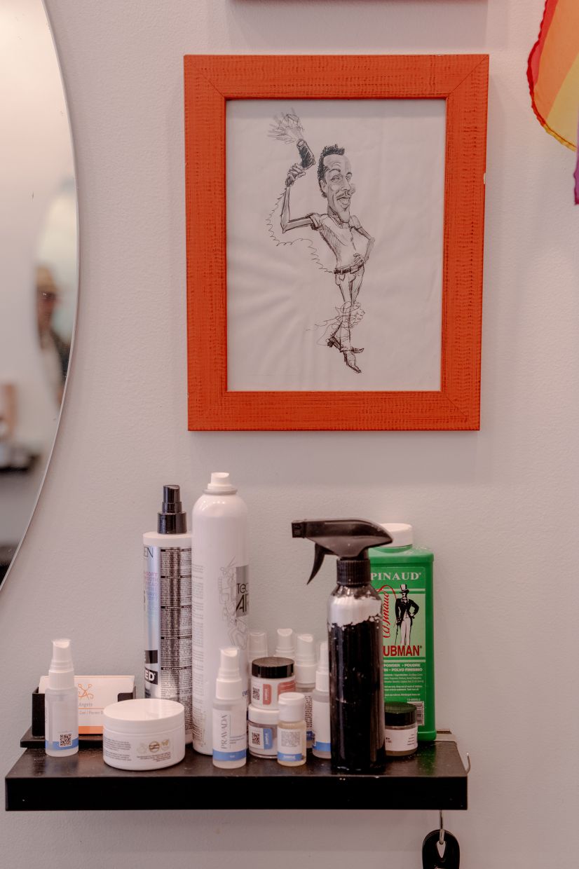 A framed drawing of stylist Angelo Vega wielding a blow-dryer on display at Anonymous Hair Salon. Photo: The New York Times