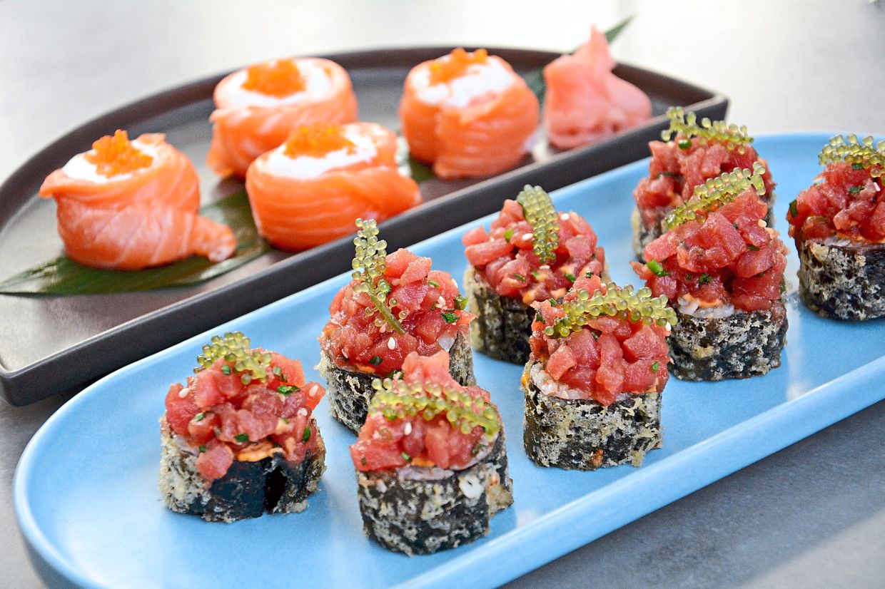 Pancho Tuna Sushi inspired by Peruvian Nikkei cuisine (front) and Hana Maki Roll.