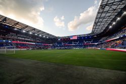Soccer-FA bans solid pitchside barriers after player dies