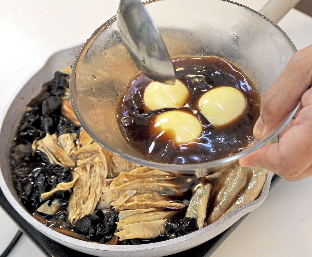 Hard-boiled eggs are marinated in the braising liquid for at least two hours, and best overnight.