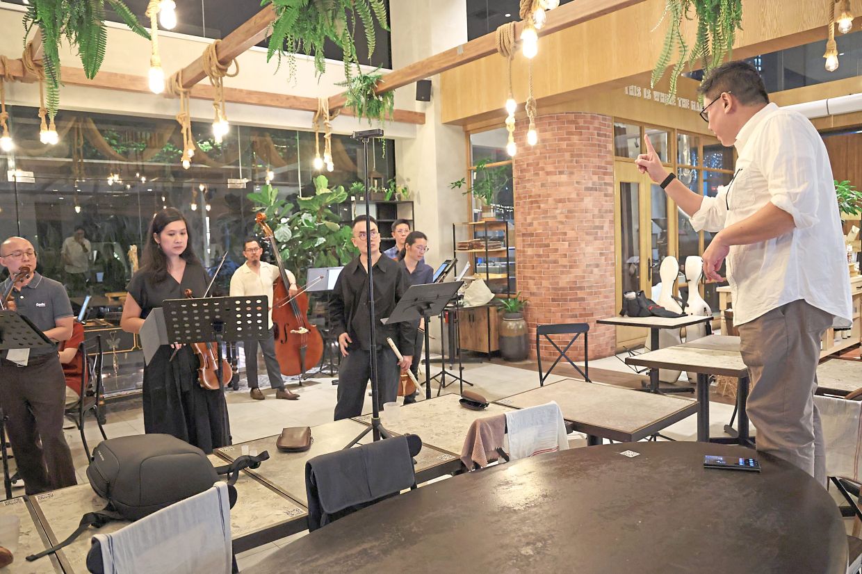 Ng (right), who has a theatre background, delivers the monologues and refines the performance during rehearsals. Photo: The Star/Glenn Guan 