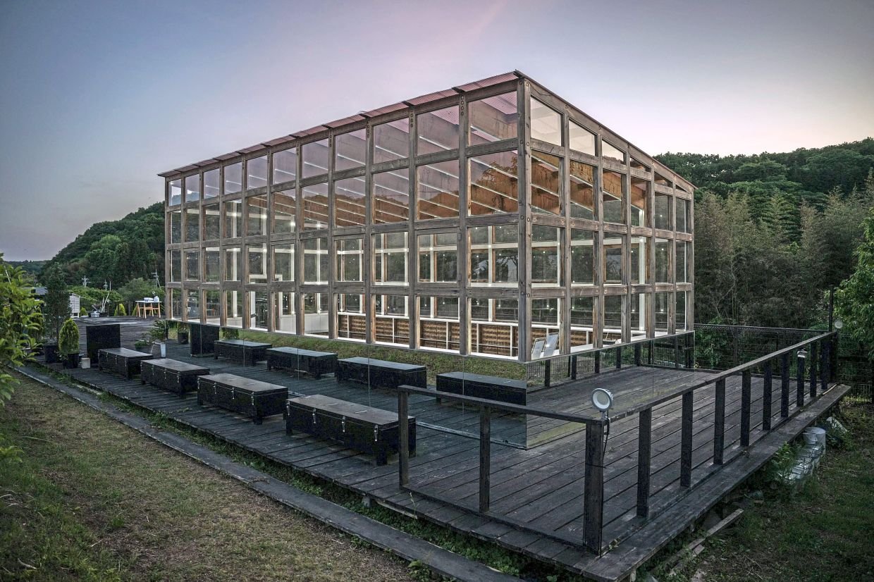 The 'Ku-An' test lab in Hitachi-ota is lit up by electricity harnessed from 1,500 wooden boxes of soil and compost.